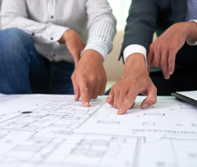 Crocker Building team reviewing architectural blueprints