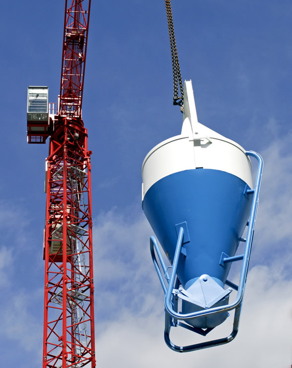 Crane lifting a steel building component on a Crocker Building Company job site